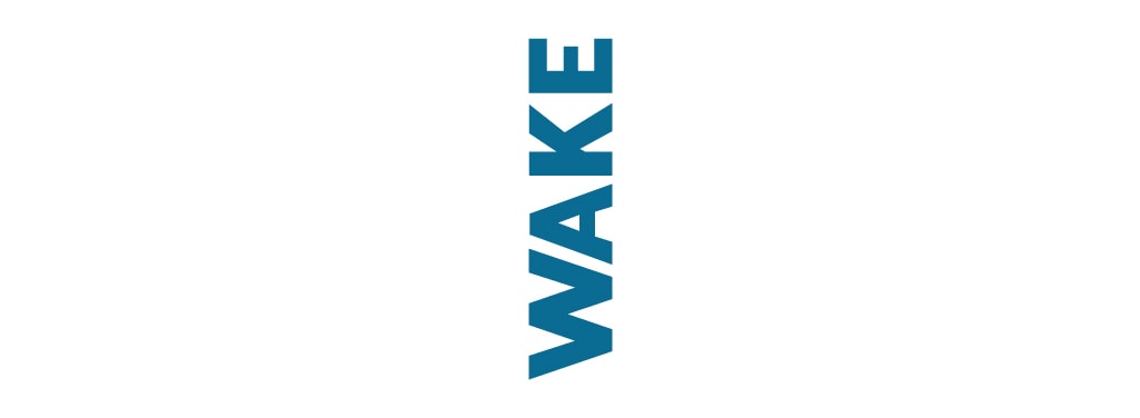 The word "WAKE" is written and read vertically starting with the 'W' at the bottom.
