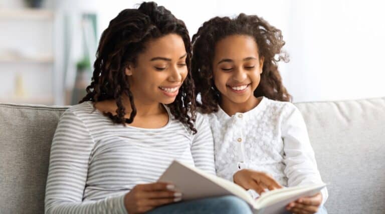 A mother and daughter enjoying their family book club experience.