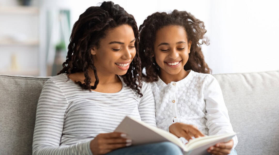 A mother and daughter enjoying their family book club experience.