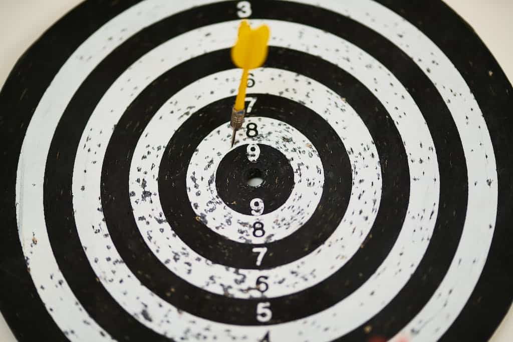 Black and White Dartboard as a metaphor for the importance of setting goals for your family book club.