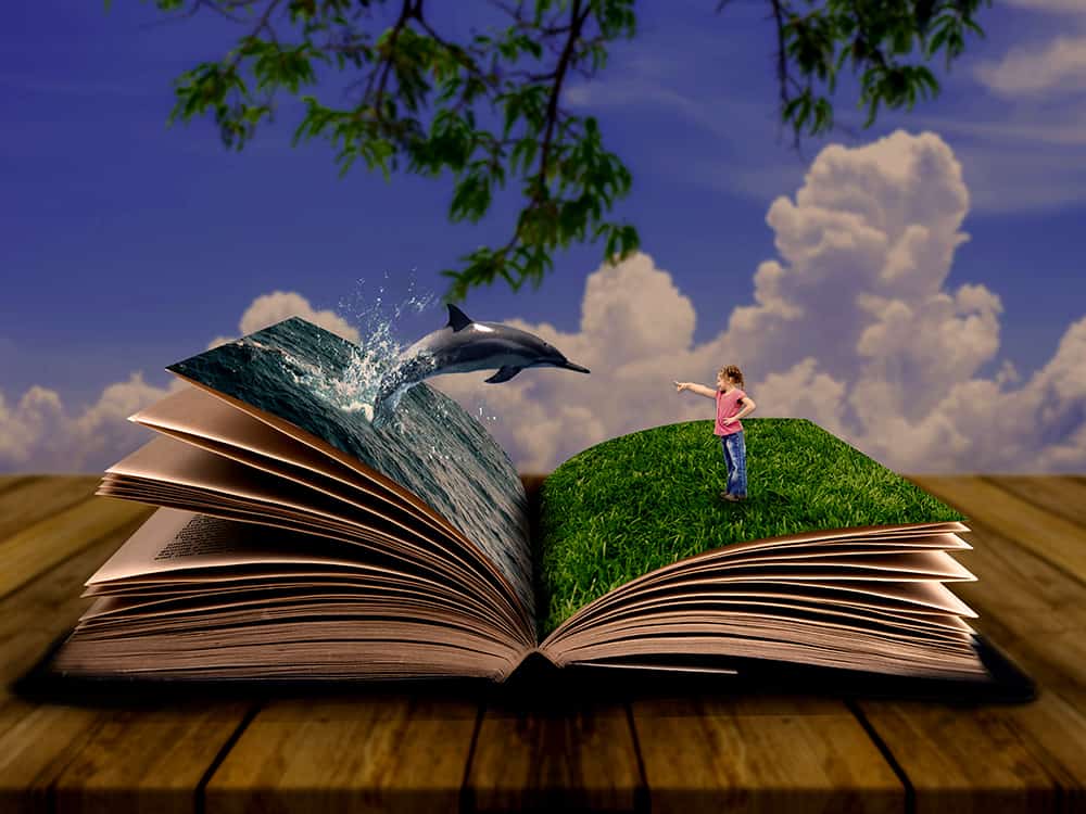 A picture of an imaginary scene where a young girl is standing in a large open story book with a dolphin jumping out.