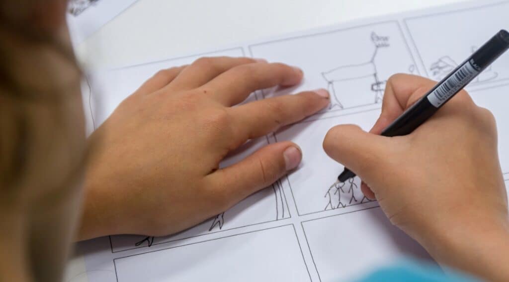 A picture of a student's hands creating a quote comic. This is one of my elementary students' favorite fun activities with quotes.