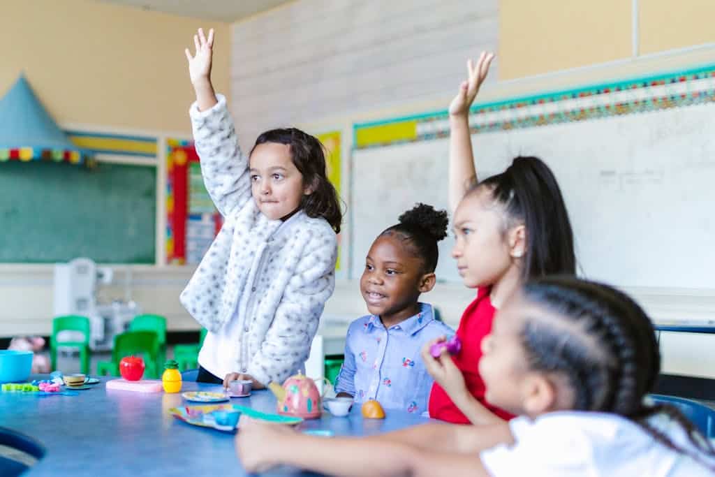 Group of young elementary students in the Classroom having fun.