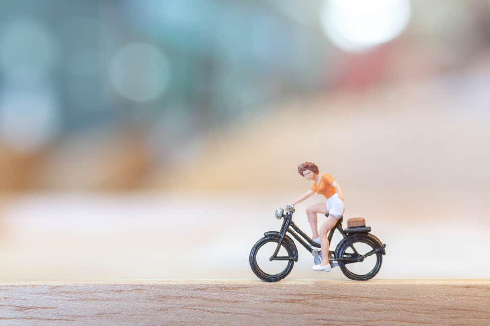 Miniature figurine cycling. This is a great activity for students to practice using parts of speech.