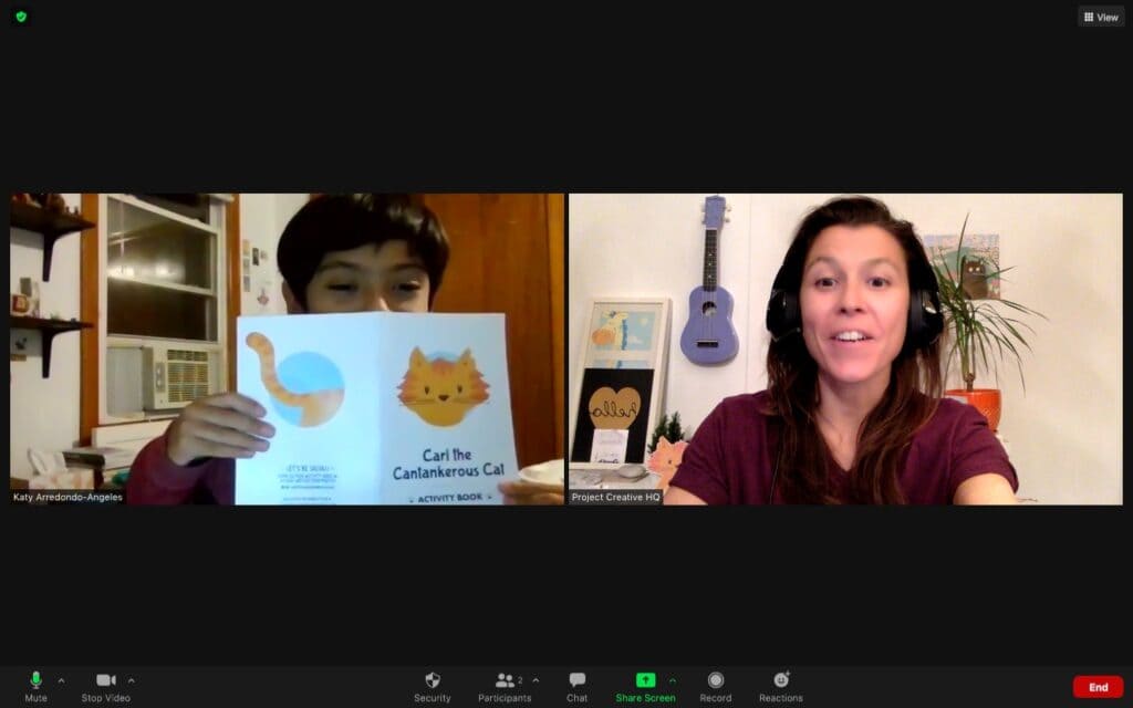 A screen shot of me and a student I taught on Outschool. He's showing me the Carl the Cantankerous Cat activity book I sent him in the mail.
