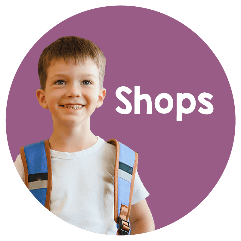 An image of a 9 year old boy smiling, wearing a backpack. When you click here you go to the That's So Montessori shops.