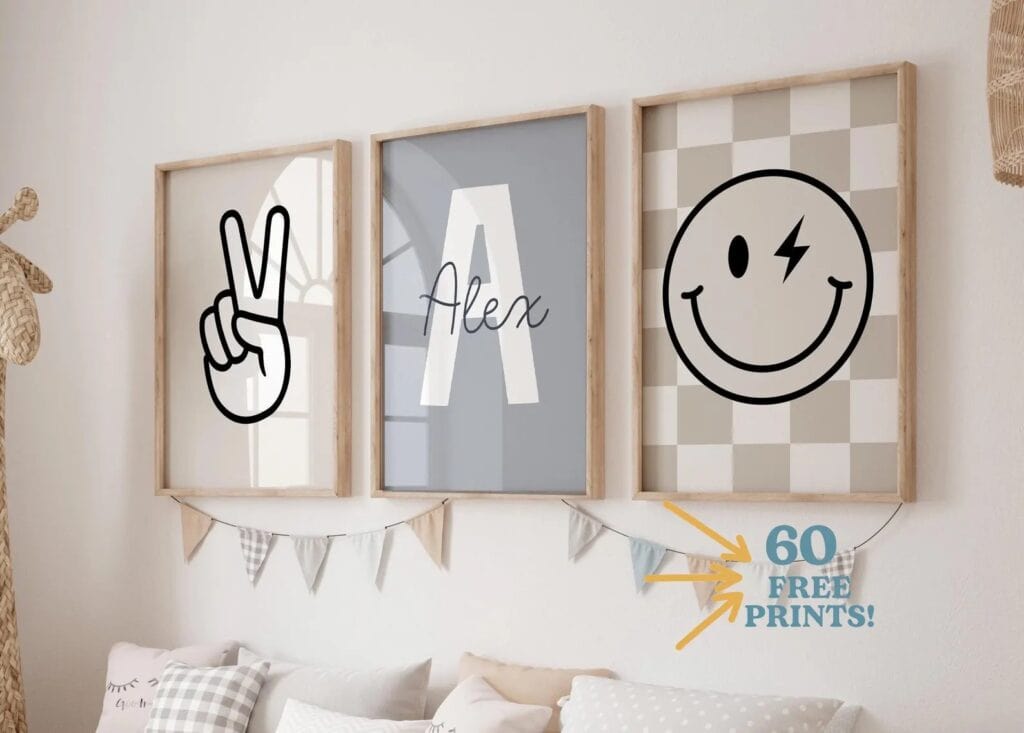 A series of 3 framed prints hanging on a wall, one showing the hand gesture for 'peace'