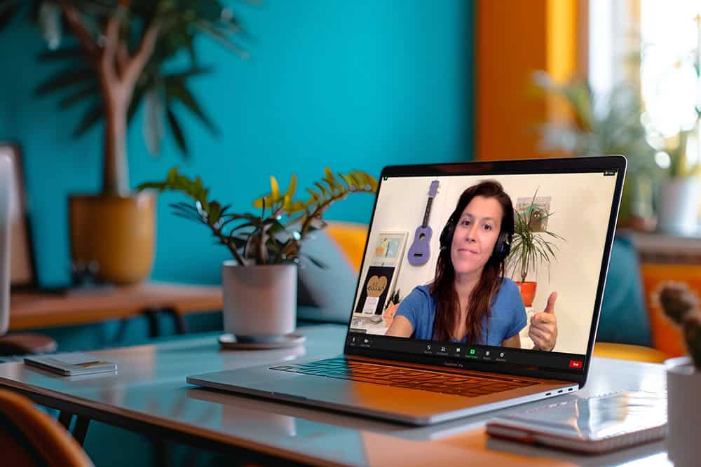 A lap top open on a desk with an Outschool class open with me, Teacher Donna ready to lead an online class.