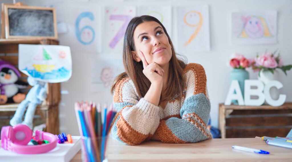 A picture of a pensive teacher thinking about her students' needs. 