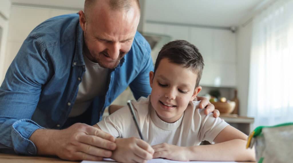 A father and son working through their back to school supplies list together.