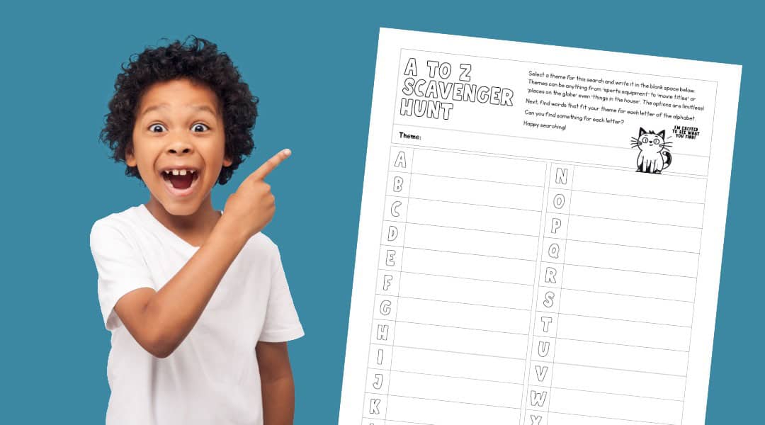 A young boy pointing and smiling at our alphabet scavengner hunt printable.