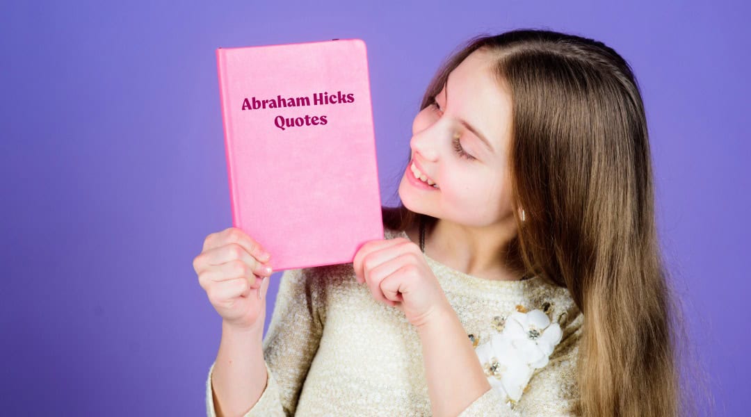 An image of a young girl holding a book of Abraham Hicks quotes.