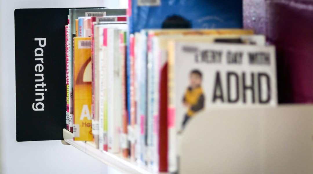 A picture of the parenting section of a bookstore.