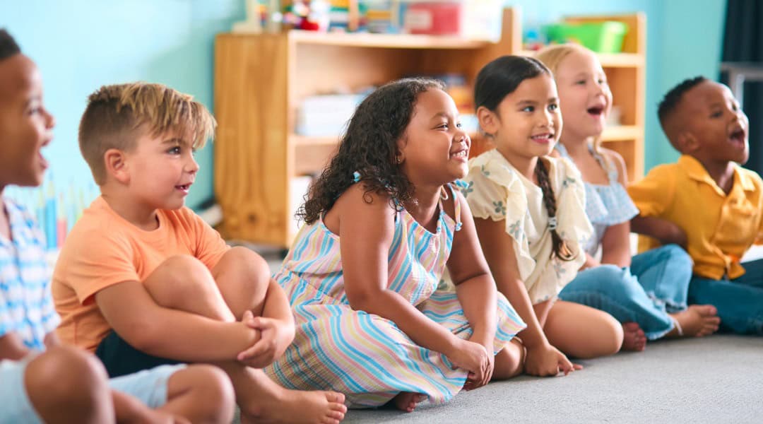 A group of grade 1 students ready for their Montessori great lesson.