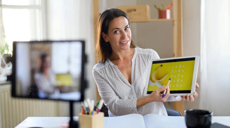 An image of a teacher teaching an online class with Outschool.