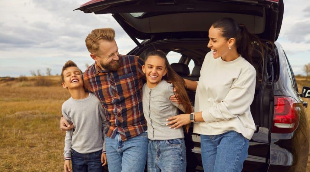 A family of four stopped for a break and engaging in a storytelling game to play on their road trip.