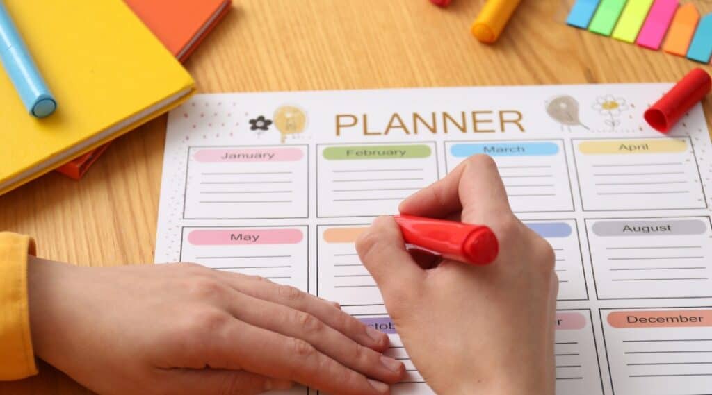 Elementary student using a planner to develop organization and time management.